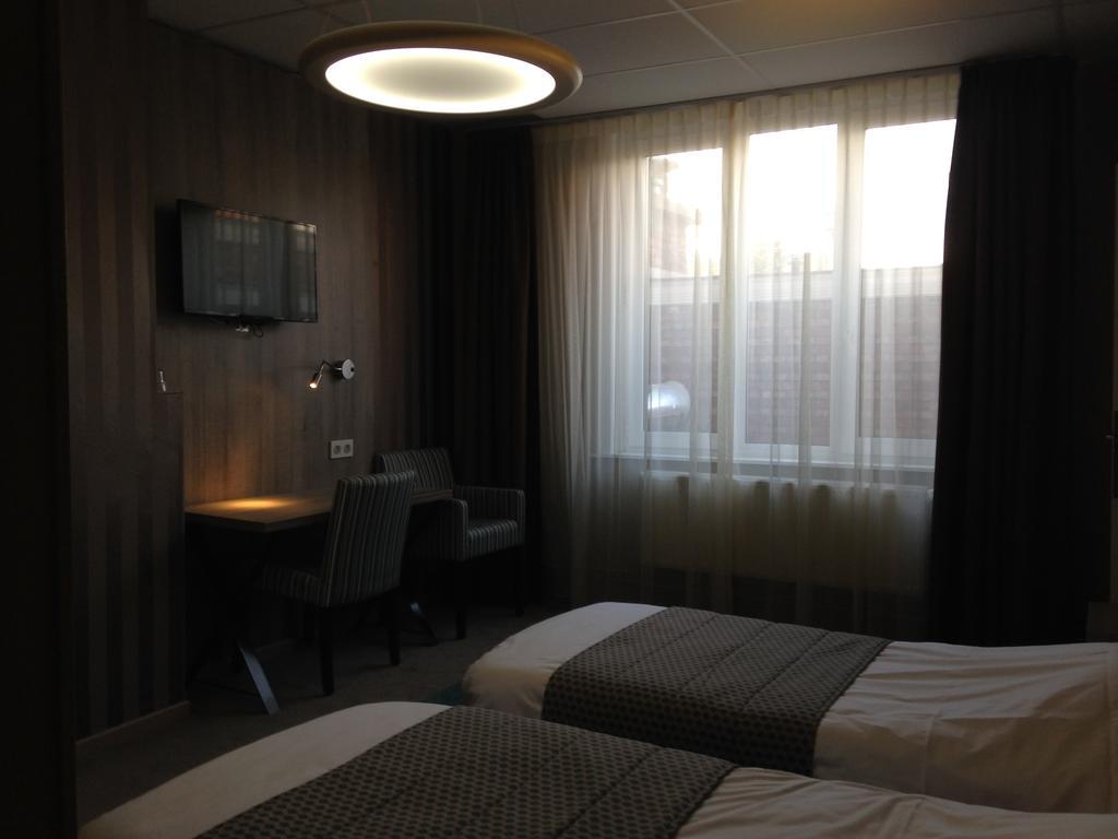 Hotel Mille Colonnes Leuven Oda fotoğraf
